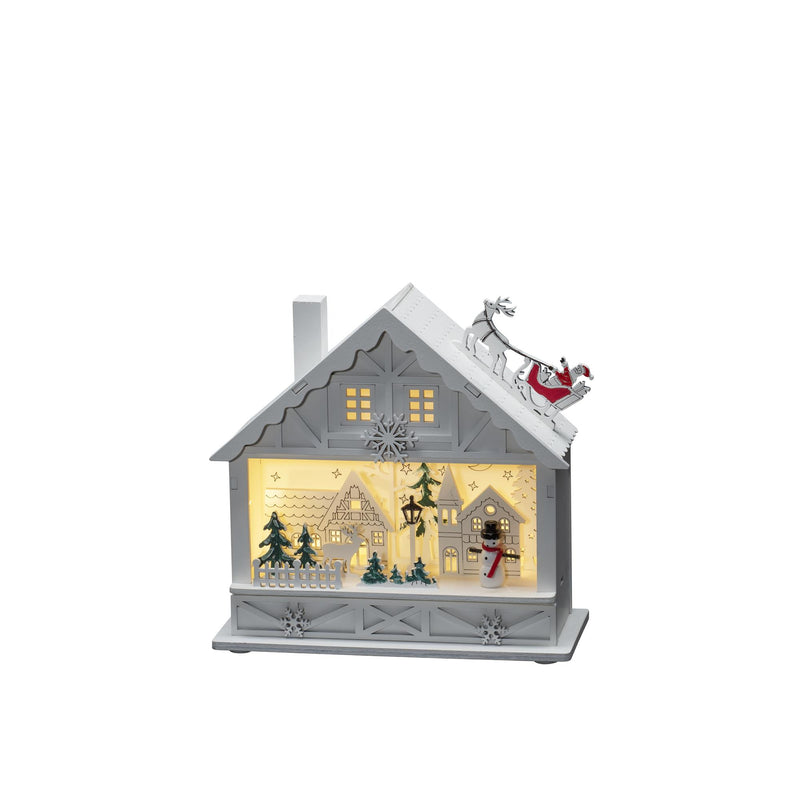 Christmas White Wooden House with Santa On The Roof Scene