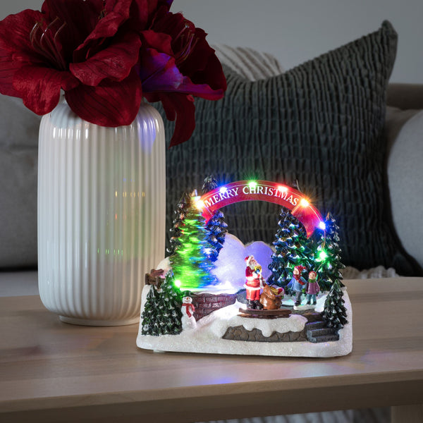 Animated Christmas Scene with Santa and Gifts