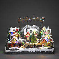 Magical Christmas Village Scene with Flying Santa and Reindeer - 3
