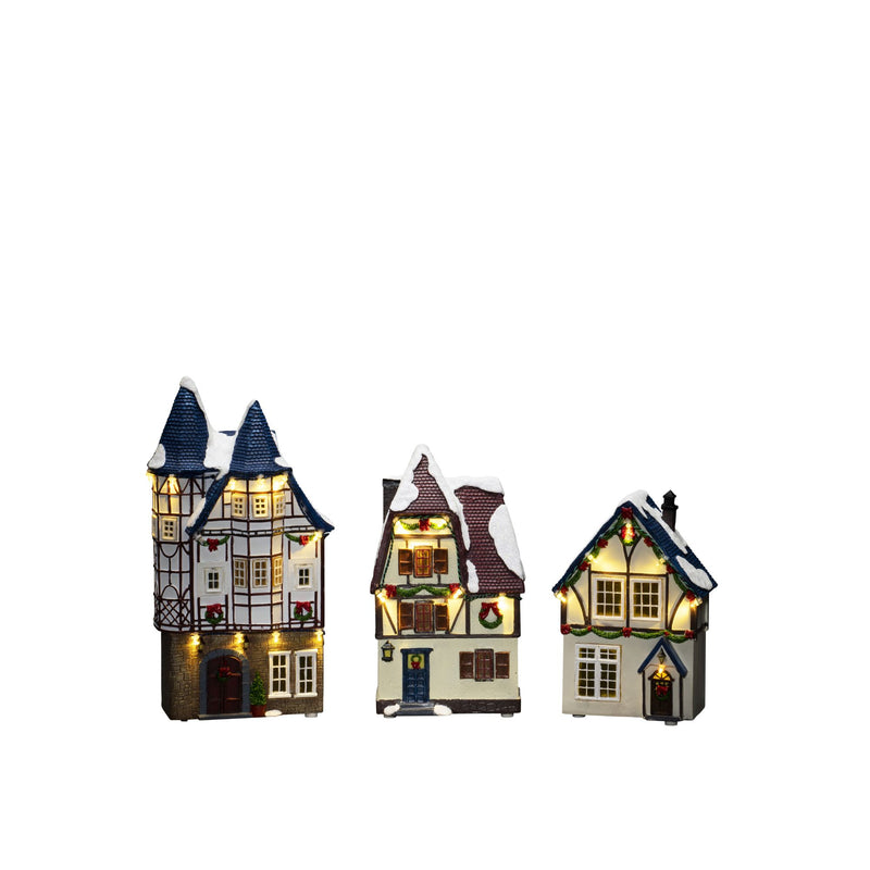 Trio of Small Houses Lit with LED Lights