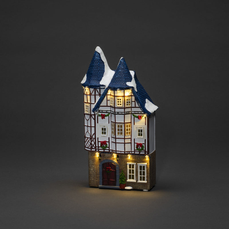 Trio of Small Houses Lit with LED Lights