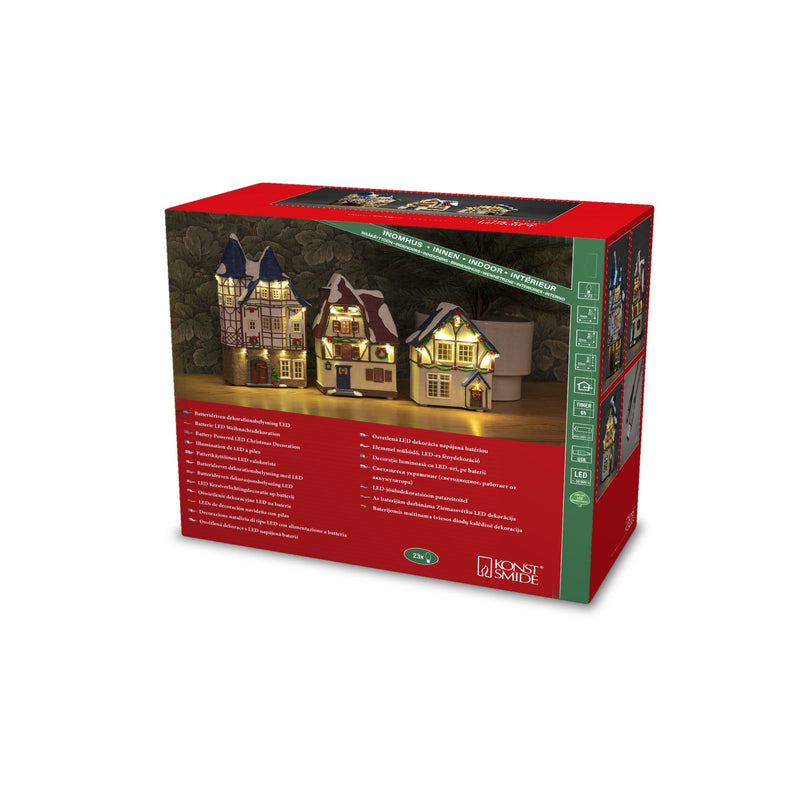 Trio of Small Houses Lit with LED Lights