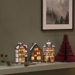 Set of Three Small Snowy Houses Lit with LED Lights