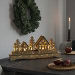 LED Wooden Village Silhouette With Snowman